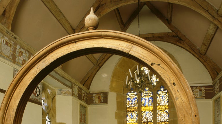 View of chapel with roof renovated by Thomas Lyte 1631, frieze of family's coat of arms, stained glass windows installed 1912 by Sir Walter Jenner.